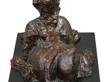 bronze statue of a boy with a turkey on a black marble base