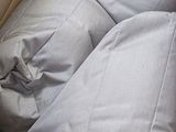 two pillows and a pillow case in the back of a car