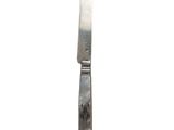 a knife that is sitting on top of a table