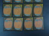 six magic the gathering board game cards are arranged on a table