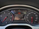 a close up of a car dashboard with various gauges