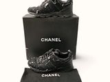chanel black leather sneakers with silver studding and a black box