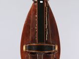 a small wooden instrument hanging from the ceiling