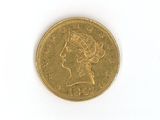 a gold coin with a picture of a woman on it