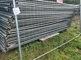 a fence that has a bunch of pipes on it
