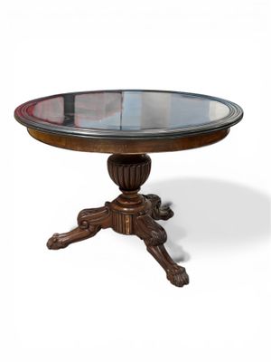 une image d'une table avec un plateau en verre sur un fond blanc