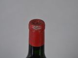 a bottle of wine that is sitting on a table