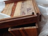 a wooden box with a drawer in it on the floor