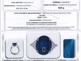 an advertisement for a blue diamond ring with a diamond in the center