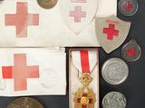 an image of a collection of medals and other items on a table