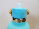 a blue water bottle with a yellow cap on it