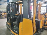 a forklift truck that is parked in a warehouse