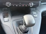 a close up of a car ' s dashboard with a gear stick