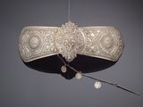 an old silver purse with a chain hanging from it ' s side