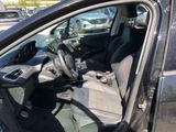 the interior of a car with the door open and the driver ' s seat down