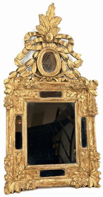 a gold mirror with a picture of a man on it