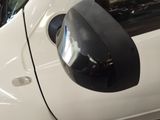 a close up of a car ' s side mirror and door handle