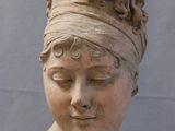 a statue of a woman with a head scarf on