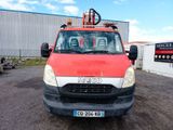 a red and white truck parked in a parking lot