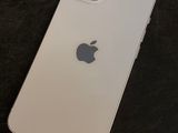 a close up of a white iphone sitting on top of a table