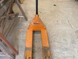 a fork lifter that is sitting in a garage