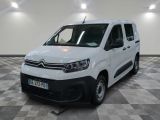the white van is parked on a checkered floor in a room