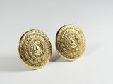 a pair of gold plated earrings with circular design