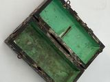 a green box that is sitting on a white surface
