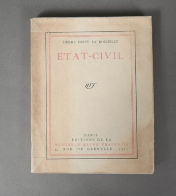 a close up of a book on a table with a gray background