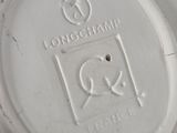 a close up of a white plate with a logo on it