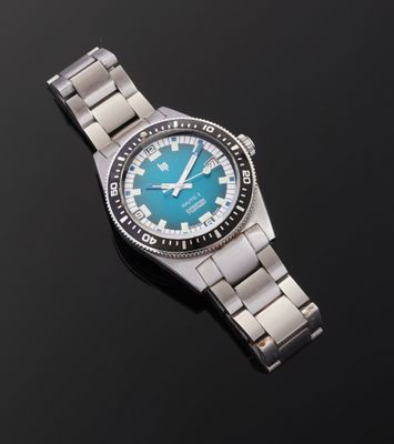 a close up of a watch on a black surface with a black background