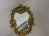 a mirror that is sitting on top of a table