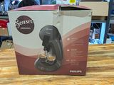 a box that has a coffee maker inside of it
