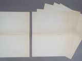 several pieces of paper are stacked on top of each other