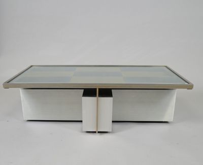 an image of a coffee table with a glass top and metal legs