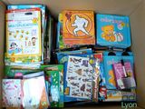 a cardboard box filled with books and other children ' s books