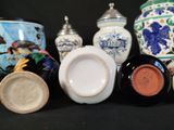 many vases that are sitting on a black table
