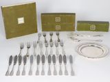 an assortment of silverware including forks, knives, and a box