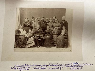 an old black and white photo of a group of people posing for a picture