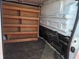 a white van with shelves in the back of it