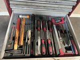 many different tools in a tool box on the floor