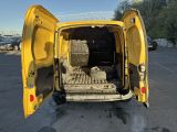 a yellow van with its doors open in a parking lot