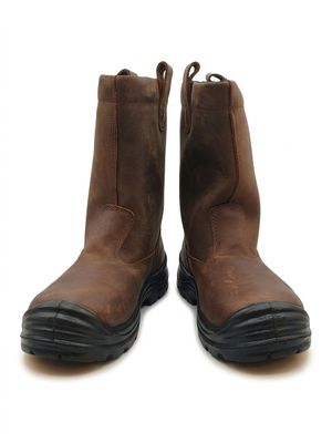 brown leather boots with black soles on a white background