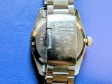 a watch that is sitting on a blue surface