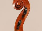 an old violin with a wooden back and a long neck