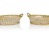 a pair of gold plated baskets with rope handles
