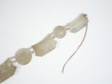 bracelet made of glass and silver beads on a white background