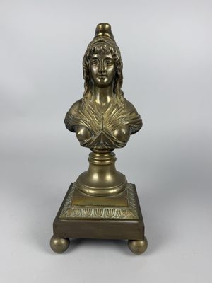 a bronze bust of a woman on a pedestal with a white background