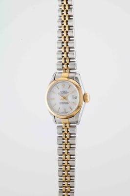 a lady ' s rolex watch with a white dial and two tone bracelet