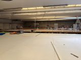 a large room with a lot of construction materials on the floor
